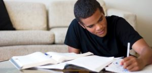 Student doing his assignment 15 habits of highly successful students