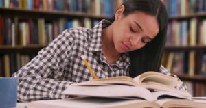 Female student reading A girl revising her books