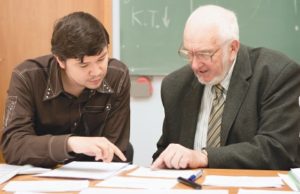 A lecturer teaching a student 15 habits of highly successful students
