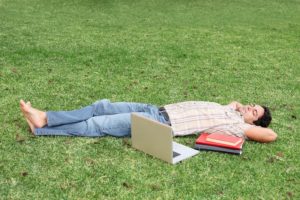 Student taking a break after reading for hours 15 habits of highly successful students